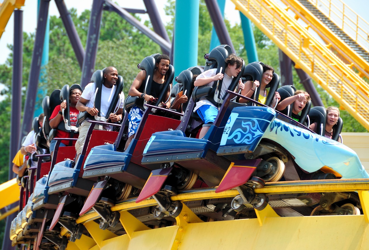 People enjoying a fast-paced roller coaster, one of the best attractions in Pigeon Forge